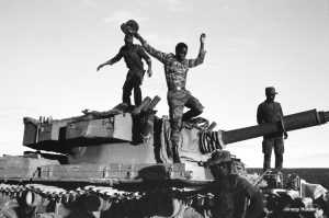 Government troops inspect captured South African tank, Angola 