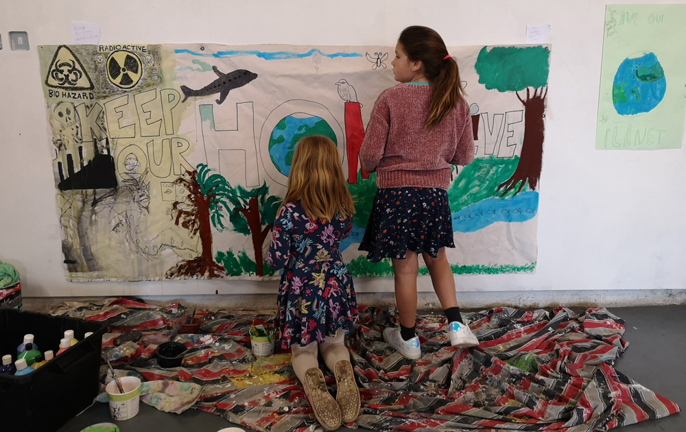 Kids making a banner in The Space